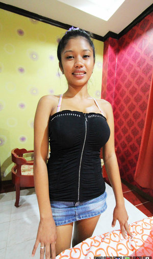 18 year old girl Megan Rain removes her sandals and then clothes to pose naked